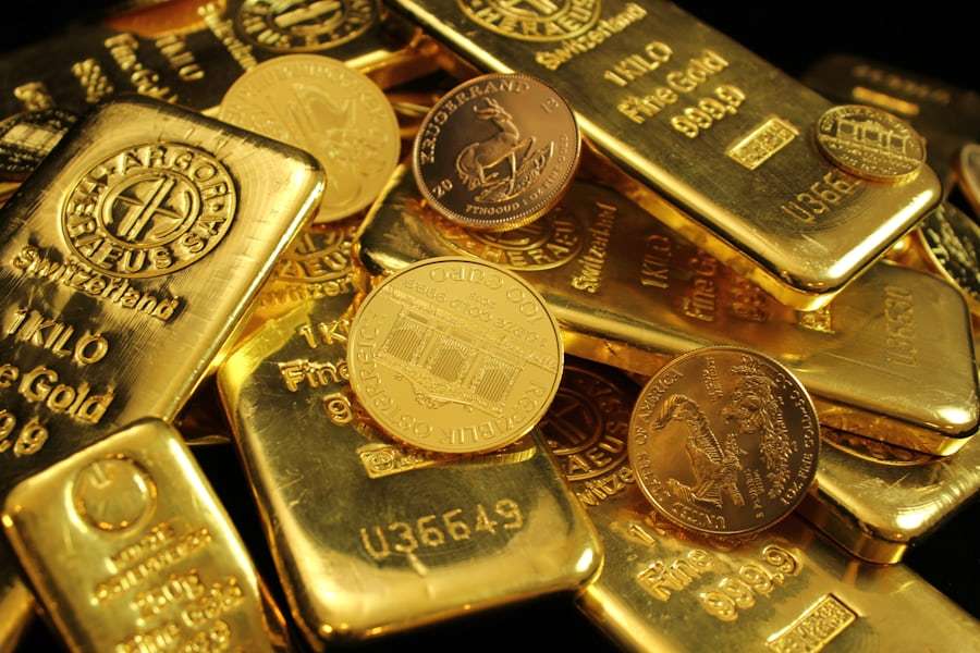 Tumpukan koin berwarna emas melambangkan bonus deposit